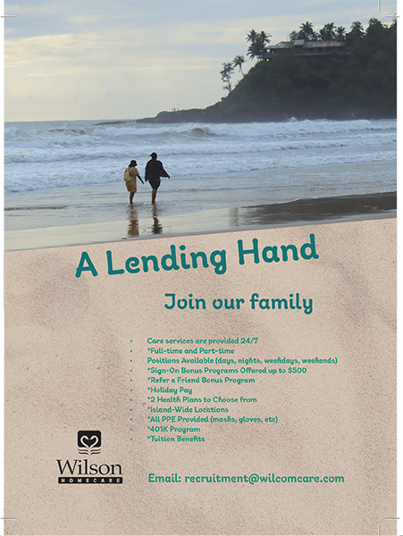 an old lady with her caretaker walking along the hawaii beach